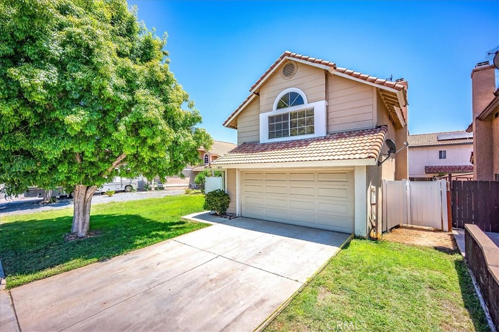 This charming 2-story home offers 3 bedrooms and 2.5 bathrooms, blending comfort and character throughout. Featuring vaulted ceilings the living room, fireplace in the family room, a dining area and all brand new carpet flooring, the home provides both style and practicality. Low maintenance yard and beautiful curb appeal. NO HOA or Mello Roos.