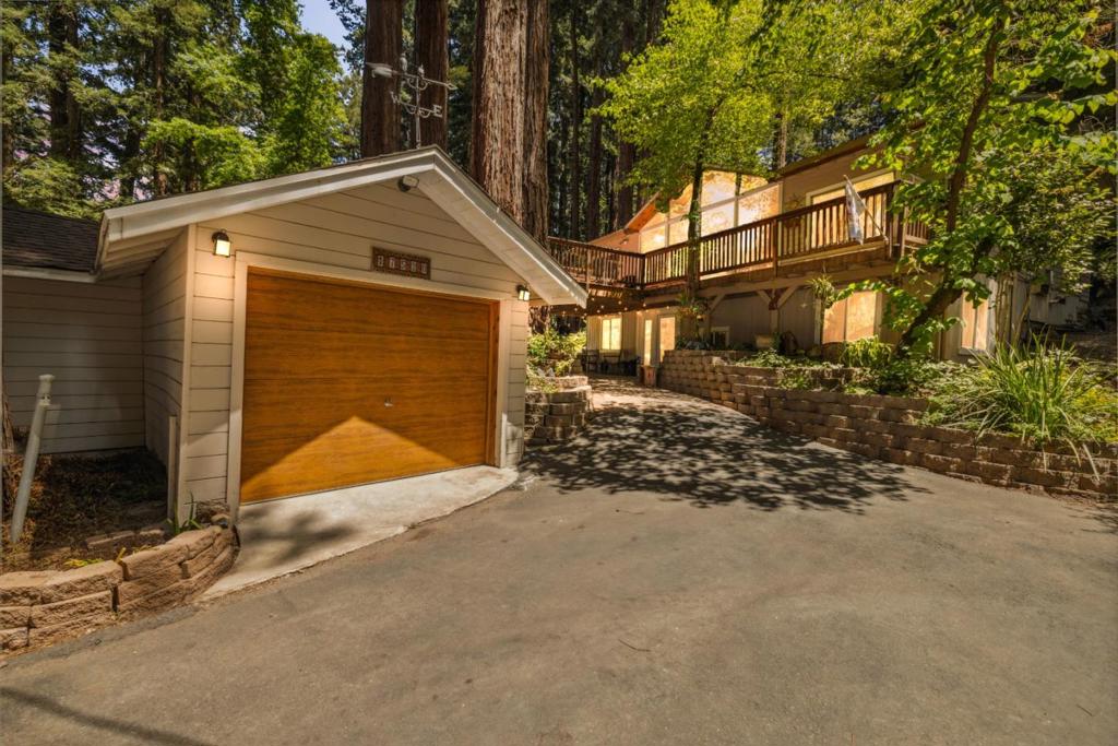 Nestled in the quiet, community-oriented Chemeketa Park neighborhood of the Los Gatos Mountains, this 4-bedroom, 2-bath home offers room to relax and unwind on its generous 0.3-acre corner lot. Enjoy a sense of peace and privacy while staying just minutes from bustling Silicon Valley, SJC, and vibrant downtown Los Gatos, with its acclaimed restaurants, charming boutiques, and scenic hiking and biking trails. In the other direction, the iconic beaches and world-class surf of Santa Cruz are only 25 minutes away, truly the best of both worlds. Inside, the home showcases unique, handcrafted details and a thoughtfully designed floor plan that flows seamlessly from room to room. Entertain guests on the expansive deck, perfect for al fresco dining through summer and fall, with parking for up to seven vehicles. even an oversized one. Cozy winter days are best spent in the living room, curled up by the fireplace as raindrops dance on the floor-to-ceiling windows. At the end of the day, retreat to the serene primary suite, where enchanting treetop views help you unwind. Come experience this one-of-a-kind mountain retreat and make it yours.