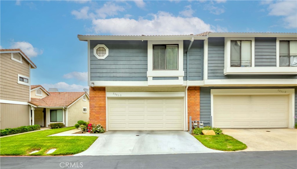 Welcome to elevated living in the prestigious Silver Hawk Community of Diamond Bar, where luxury, location, and lifestyle converge within the acclaimed Walnut Valley School District. This beautifully appointed end-unit townhome is ideally situated along a serene greenbelt, offering peaceful views and abundant natural light throughout. Enjoy a stunning first impression when entering as you are welcomed by soaring ceilings with tastefully designed living and dining areas effortlessly flowing to a private patio—perfect for indoor-outdoor entertaining. The inviting living room delivers a cozy fireplace, while the thoughtfully designed layout includes two spacious en-suite bedrooms and a generous loft-style bonus room with a half bath and mirrored closet—ideal for an executive office, creative studio, or conversion into an additional bedroom(can be two bedroom). The residence has been tastefully updated over time, including double pane windows throughout, luxurious marble wall bath with a soaking tub, and a full plumbing re-pipe. Additional highlights include an attached two-car garage and access to a meticulously maintained community with HOA amenities that cover water, trash, exterior insurance, and landscaping. Conveniently located near top-rated schools, and major freeways, this exceptional home blends elegance, comfort, and prime accessibility-offering a lifestyle of distinction in one of Diamond Bar’s most sought-after neighborhoods.