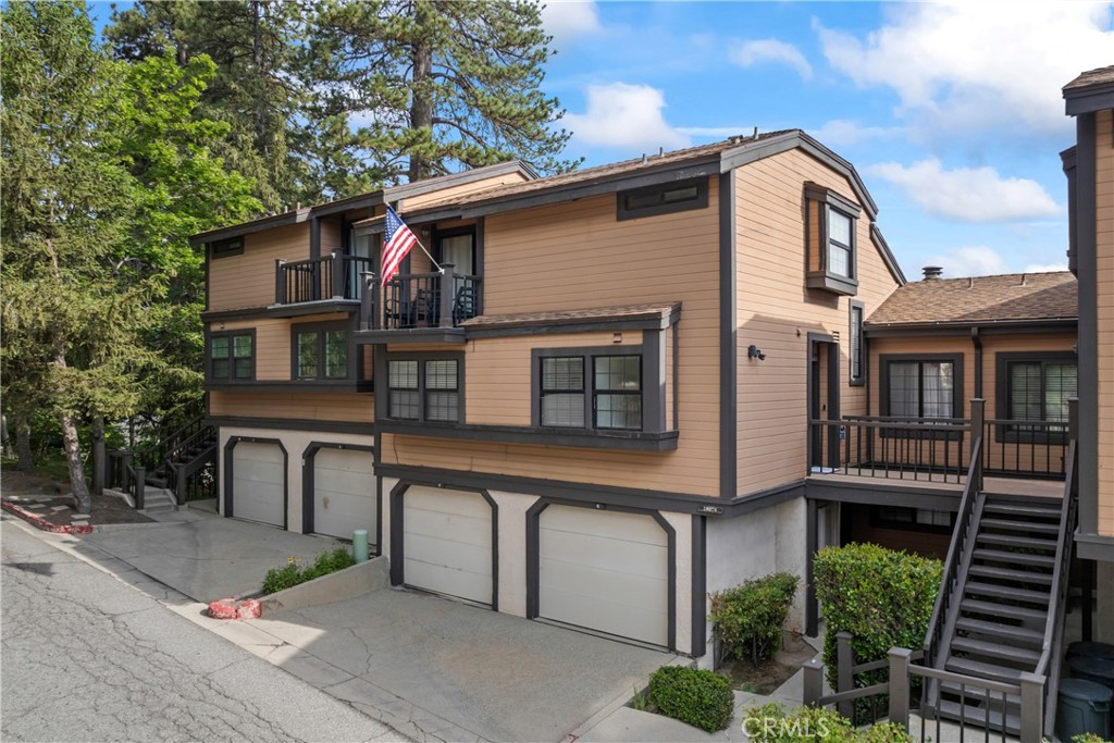 Enjoy this Spectacular 2-Story 1,303 sqft completely remodeled Panoramic Lake View Condo complete with Multi-Slip Dock, Level Entry Single Car Garage with Level 11 Electric Car Charger centrally located in the Heart of Lake Arrowhead Village. Main Floor Features: Newer Flooring, Guest Bedroom, Full Bath, Laundry Closet with GE Stack Washer and Dryer, Goodman Central Heating Closet, Kitchen with Whirlpool & GE Stainless Appliances and Stainless Deep Basin Double Sink that Opens to Dining Area and Vaulted Ceiling Living Room with Rock Fireplace and Direct Access to the Entertaining Lake View Deck complete with Extra Storage, Cocktail Railing and BBQ simply ideal for Viewing the 4th of July Fireworks! Upper-Level Features: Super Spacious and Private En-suite Primary Bedroom with Office Area and Deck. Upgrades Throughout Include: New AC and Remote Access Honeywell Thermostat, New Stone Façade Rock Fireplace and Mantle, New Kitchen Cabinetry, New Granite Countertops, New Kitchen Appliances, New Main Floor Bathroom Cabinetry, Granite Counter, Shower Glass & Door, Primary Bath with New Cabinetry, New Granite and Toilet. This Unit offers loads of Extra Storage, Dock Box at the Slip, Free Beach Club Membership and is being offered Turn-Key and Fully Furnished! Plenty of options for Additional Guests with Sofa Beds and Pull-out Trindle so bring them as well to Experience the Ultimate Lake Arrowhead Lifestyle!