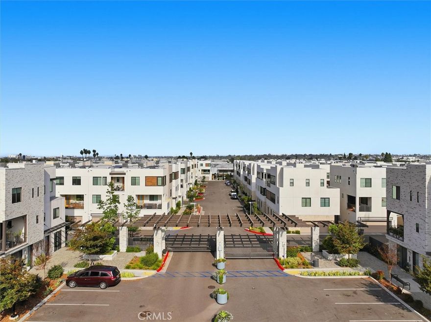 Rare opportunity in Rosecrans Place—an upgraded 2022-built townhome that lives more like a single-family home. Set deeper in the community for added privacy, this residence offers 2,405 sq ft across three levels with a modern layout and extensive enhancements. The gated community includes an upgraded call box, Amazon lockers, plentiful guest parking, and HOA-included high-speed internet. The first floor features an open-concept living area with 9' ceilings and direct access to front and rear yards. The kitchen offers a huge island, quartz countertops, subway tile backsplash, induction cooktop, stainless steel appliances, pull-out cabinetry, a farmhouse sink, and a touch-sensor faucet. LVP flooring, recessed lighting, and hidden cable management complete the space. Upstairs, the primary suite includes custom his-and-hers California Closets. Three additional bedrooms share an oversized hall bathroom with dual sinks and upgraded tile to the ceiling. A full laundry room with cabinetry and a sink adds convenience.
The third-floor bonus level provides exceptional flexibility—perfect for a media room, office, gym, or guest lounge—with its own balcony plus cabinetry and quartz-topped bathroom finishes. The home is fully electric, solar-powered, and extensively upgraded with smart features: smart switches in the living room and primary bedroom, a smart front door lock, and app-controlled water heater and garage door. Additional improvements include a whole-house water softener, reverse osmosis filtration, refrigerator water line, and window treatments. The two-car garage includes an EV outlet, and the entry features privacy gates. The location is central to LAX, Long Beach Airport, DTLA, West LA, South Bay beaches, SoFi Stadium, Kia Forum, Del Amo Fashion Center, and numerous dining and coffee spots. Easy access to the 110, 105, 91, and 405 freeways supports convenient commuting.
A standout blend of space, upgrades, technology, and efficiency in a sought-after newer construction community.