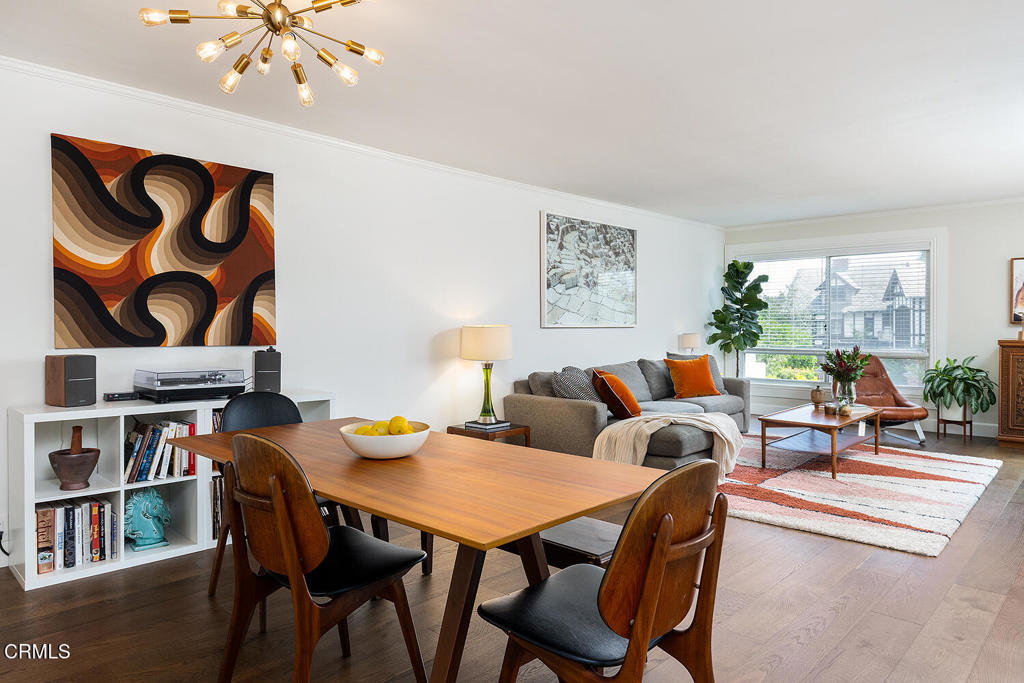 Lifestyle on the Arroyo! This natural light-filled, fully updated condo in prime Pasadena is a knockout. Moments from Old Town Pasadena and adjacent to historic Prospect Park, welcome to quiet, well-maintained Arroyo Terrace. Unit 204 is a spacious single-level unit with upgrades galore: a generous entry, wide plank wood flooring, crown molding, semi-open concept public rooms and a comfortable private balcony with leafy treetop views. Offering 1,380 SF of living space, the home features a large great room with dining area and adjoining upgraded galley kitchen boasting stone countertops, quality shaker cabinetry and stainless steel appliances. The floor plan here is so well designed, with the kitchen accessible via both dining room and entry - convenient for unloading groceries, and maximizing the flow - this space is designed for ease in the everyday. Living room and primary suite share access to the sunny private balcony, a breezy spot to entertain al fresco or enjoy morning coffee while taking in views of the landmark Holly and Colorado street bridges. The primary bedroom is spacious and enjoys an upgraded ensuite bath with custom tiled shower, linen storage, open shelving and walk-in closet. Behind double doors off the entry, find the second sun-filled bedroom with nicely sized closet. The second bath is located off the entry as well, convenient for guests and the adjoining bedroom. A tidy laundry room just outside the unit is the icing on the cake - so easy! Storage is ample both in the unit and within the building; cyclists will appreciate the bike room, and the unit has a private storage space in the garage. Two side-by-side parking spaces are in the garage below, accessible via elevator close by. A large pool (heated during the swimming months) with patio and grilling area are ready for summer fun, and just outside the gate find a short trail that leads directly to Brookside Park, Kidspace Museum, tennis courts and nature trails. Looking for a special, upgraded 2 bedroom condo in Pasadena? It doesn't get better than this!