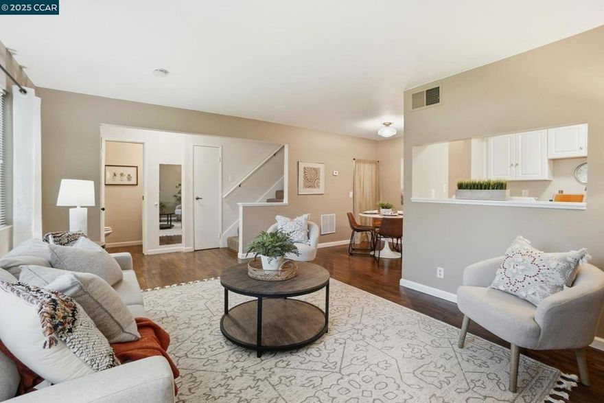 Discover comfortable living in Concord’s sought-after Del Rio Court community. This inviting two-story condo offers approx. 877 sq. ft. of well-designed space, featuring 2 bedrooms and 1.5 baths. The main level includes a bright living area and an updated kitchen with solid-surface counters, modern cabinetry, a stainless dishwasher, and direct access to the attached garage where the laundry is located — a rare convenience in condo living. Fresh carpeting, dual-pane vinyl windows, and tasteful updates throughout add to the home’s appeal. Upstairs, both bedrooms offer generous proportions and calming, neutral finishes, creating ideal spaces for rest and relaxation. Parking is effortless with an attached garage plus an additional tandem space. Residents enjoy access to the community pool and beautifully maintained greenbelt areas, while HOA dues cover water and trash for added convenience. With close proximity to shopping centers, restaurants, schools, parks, and major commute routes, this move-in-ready home delivers an easy, convenient lifestyle in a central Concord location.