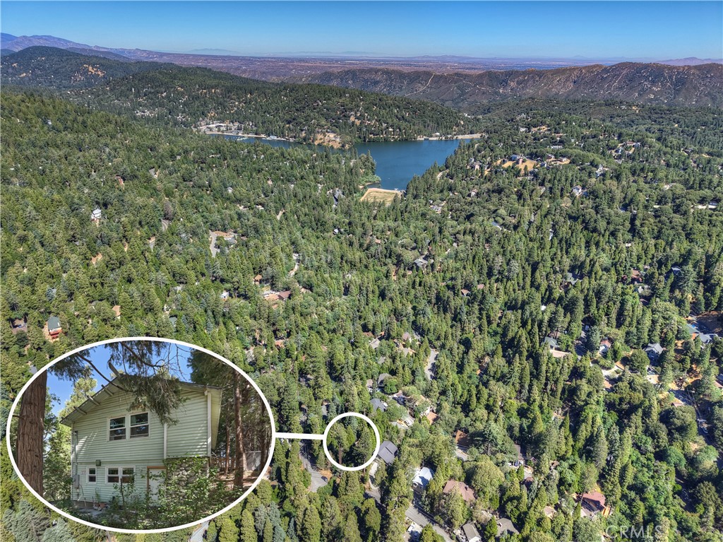 Located in the popular San Moritz neighborhood of Crestline and only minutes from Lake Gregory is this charming 3 bedroom, 1 bath home, with level entry and plenty of parking. The lower-level features stone walls and an open concept floor plan. The living room flows into the kitchen, and you will also find the bathroom on this level. The second level has two large bedrooms and a medium sized bedroom. All in all, this is a very comfortable and cozy home with pleasing curb appeal. The level backyard really stands out as a rare feature in the mountains. A privacy fence has been added, along with a chain-link fence with a gate, providing a secure area for kids or dogs to play. Crestline is a great place to live full time or part-time. You will love the local the trees and forest environment, the community events and also the quaint rural feeling that affords a break from the concrete jungle. Crestline is also within a reasonable commute time to San Bernardino, Redlands, Rancho Cucamonga and Riverside.
*There is a place noted by the current owner's plumber to add a 1/2 bathroom and laundry hookups.