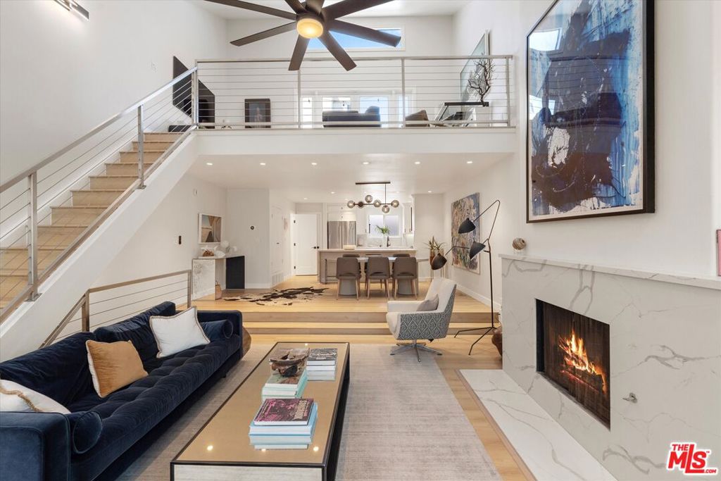 Completely Renovated Ocean Park Townhome with Ocean Views & Rooftop Deck. Welcome to beachside luxury in the heart of prime Ocean Park Santa Monica. This completely remodeled 2-bedroom, 2.5-bathroom + loft townhome spans approximately 1,700 sq ft, featuring soaring 20+ foot ceilings, a loft with private rooftop deck and ocean views, and a rare sense of volume, light, and flow. Every inch has been thoughtfully designed for elevated coastal living. Step into the expansive open living space with abundant natural light, custom finishes, and incredible indoor-outdoor flow. The chef's kitchen boasts a massive center island, custom cabinetry, and stainless steel appliances ideal for entertaining or quiet nights in. The primary suite includes a spa-like en suite bath, generous closet space, and double French doors opening to a sprawling private patio perfect for coffee, sunbathing, or sunset cocktails. Both bedrooms feature en suite baths, and the loft adds flexible space for a home office, creative studio, or guest area all leading to a rooftop deck with ocean views. Additional highlights include: Direct access from your 2-car side-by-side garage spaces with large additional storage area. In-unit laundry. Low HOA dues in a well-maintained, gated community (new roof recently intalled by HOA). Moments from the sand, boardwalk, and surf at Bicknell & Neilson Way. Directly across from Main Street's shops, cafes, and restaurants. Easy access to the 10 freeway, bike paths, and transit options. With unmatched location, coastal charm, and modern updates throughout, this is the perfect home base for true beach living. Just bring your toothbrush, bike and surfboards, this one's move-in ready. Shown by appointment only a must-see in person to truly appreciate the scale, light, and lifestyle.