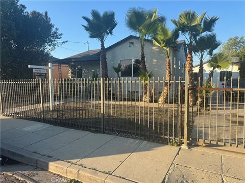 Photo of 907 W Arbutus Street, Compton, CA 90220 (MLS # PW25271521)