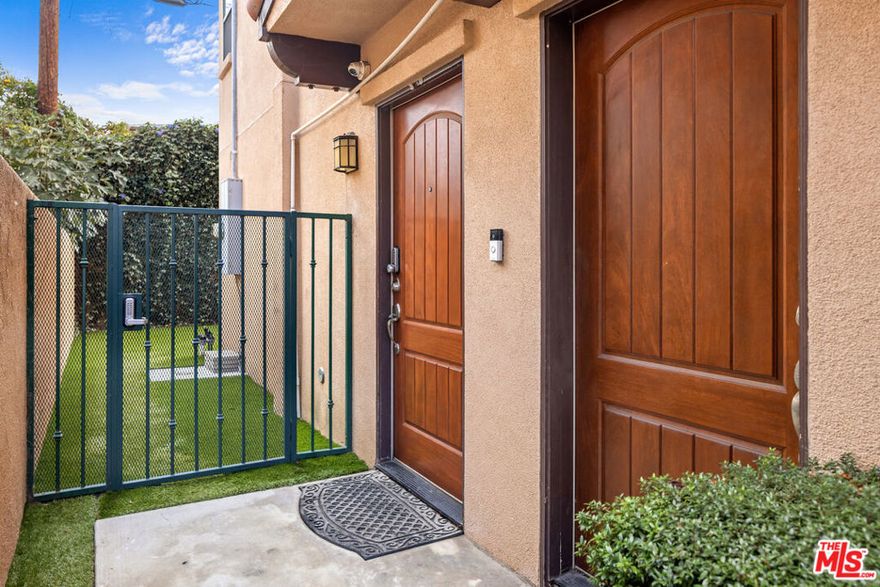 Welcome to this spacious and contemporary townhouse offering nearly 2,300 square feet of living space. Built in 2011, this 4-bedroom, 3.5-bathroom home blends modern design with practical functionality. The first floor features a large bedroom with an en-suite bathroom. The open-concept main level features a bright living area, dining space, and a large kitchen with 2 sinks and 2 stoves and a powder room. The third floor offers a large primary suite as well as 2 other spacious bedrooms with a jack and jill bathroom and a laundry room. Additional features include an attached garage, in-unit laundry, and a beautiful private outdoor yard, perfect for relaxing or entertaining. Situated in a vibrant Hollywood neighborhood, just steps from Hancock Park. Close to shops, restaurants, and major studios, this home offers convenience, comfort, and excellent value. This property will make a great home or worry free rental property.
