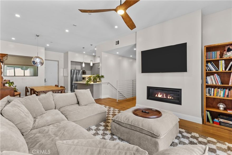 Welcome to this upscale corner-unit condo in The Gentry, a newer construction community ideally situated in the heart of Studio City. Step inside this beautifully designed open floorplan that boasts high ceilings throughout. The designer kitchen is equipped with premium appliances and flows seamlessly into the formal dining room and spacious living room, which is highlighted by a cozy fireplace and private balcony. There are two generously sized ensuite bedrooms, including a luxurious primary suite with a walk-in closet and spa-inspired bathroom featuring an oversized shower and double vanity. Additional amenities include in-unit laundry and direct access to a private two-car side-by-side garage. This property is ideally located within the top-rated Carpenter School District and just moments away from Ventura Boulevard’s vibrant shopping and dining scene, the Studio City Farmers Market and so much more.