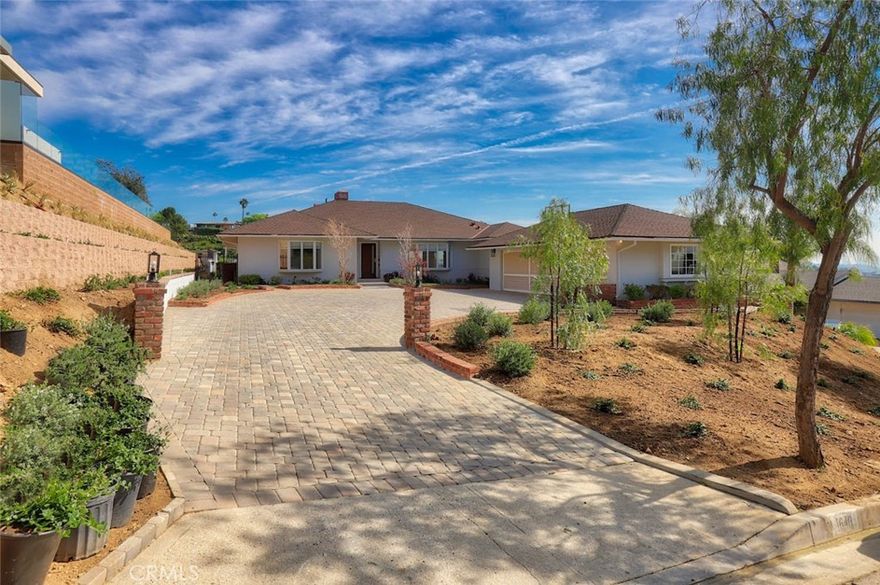 Welcome home to 1640 Cumberland Terrace, a remodeled, turnkey home w/ breathtaking views & sparkling pool nestled atop the prestigious Brockmont neighborhood of Glendale. This amazing single-story home provides a modern feel, with high end finishes throughout. Upon entering you are immediately greeted w/ an open floor plan, mountain views, romantic fireplace, and an abundance of natural light. The kitchen features custom cabinetry, quartz counters and Wolf appliances. The primary bedroom features a his and hers walk-in closet w/ custom shelving and an en-suite bath with double sinks and rainfall shower. Relax in the expansive backyard under a covered patio overlooking the pool, lush landscaping, and panoramic views of Downtown Glendale. Enjoy the convenience of a 2-car garage and paver stone driveway with plenty of parking for guests. The home also features in-house laundry area, recessed lighting, and hardwood flooring throughout. Do not miss the opportunity to enjoy this entertainer’s dream home and Glendale living at its finest!