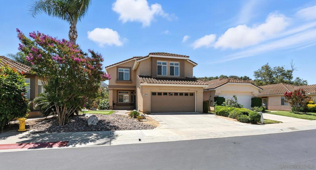 Located in the gated community of The Treasures in North Escondido, this beautifully upgraded 4-bedroom, 2.5-bath home offers 2,346 square feet of well-designed living space on a quiet cul-de-sac just steps from Castle Creek Golf Course. Inside, you'll find new luxury vinyl plank flooring throughout and an updated kitchen featuring granite countertops, refreshed cabinetry, exposed shelving, and ample prep space, perfect for everyday living or entertaining. The open layout flows seamlessly into the dining and living areas, anchored by a cozy fireplace. All bedrooms are located upstairs, including a spacious primary suite with a private balcony overlooking serene golf course views. The en-suite bathroom offers dual vanities, a walk-in closet, and a separate tub and shower. One of the secondary bedrooms is nearly the size of the primary, offering flexibility for a home office, guest room, or bonus space. The backyard is an entertainer’s dream, complete with a built-in BBQ, sink, and custom fireplace, perfect for gatherings or relaxing evenings outdoors. Additional highlights include a 2-car garage and a leased solar system to help reduce energy costs (buyer to assume lease). Residents enjoy access to community amenities including a pool, spa, and tennis court—all for just $135/month. With close proximity to I-15, Lilac School, and Valley Center’s middle and high schools, this home offers the perfect blend of comfort, convenience, and community living.