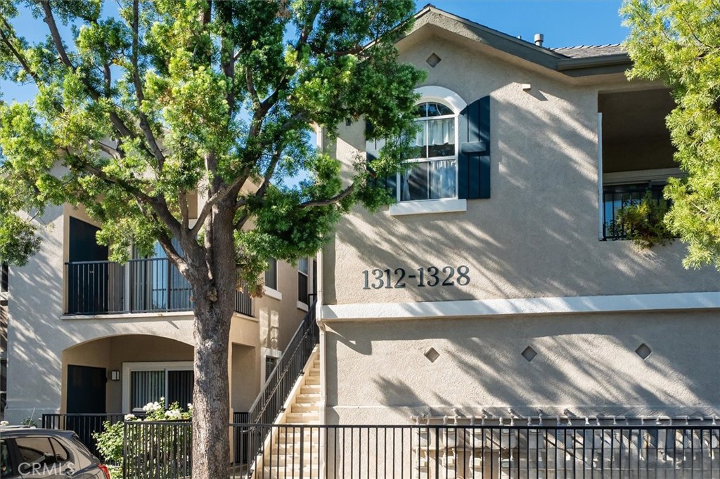 Welcome to this beautifully maintained upper-level 1-bedroom, 1-bath condo in a desirable gated community of Santa Clarita. Perfect for first-time buyers or investors, this home combines comfort, style, and convenience. Step inside to a bright and spacious living room, featuring rich wood-look flooring, large windows, and direct access to your private balcony — ideal for relaxing or entertaining. The light-filled kitchen offers ample storage, a stainless steel sink, and seamless flow into the dining area. The generous bedroom includes a walk-in closet and plenty of natural light, while the updated bathroom provides a full shower/tub combo, extended counter space, and smart storage solutions. Everyday convenience is enhanced with an in-unit full-size washer and dryer plus a single-car attached garage for parking and extra storage. Enjoy resort-style living with access to HOA amenities, including sparkling pools, a spa, fitness center, clubhouse, beautifully landscaped paseos, and secure gated entry. All this, just moments away from shopping, dining, and everything Santa Clarita has to offer. Call Today!
