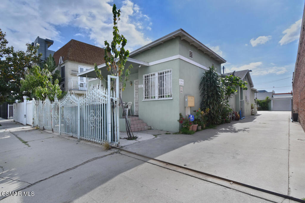 Prime Hollywood Triplex + Bonus Unit | 1041 Wilcox Ave | All Units Delivered Vacant | Property being Sold 'As is'. Unlock the potential of this rare vacant income property in the heart of Hollywood! Located at 1041 Wilcox Ave, this charming triplex + bonus unit offers the perfect blend of versatility, space, and location ideal for investors, developers, or savvy owner-users. The main triplex totals approximately 2,688 square feet and features: One 2-bedroom, 2-bathroom unit - spacious layout, perfect for an owner's unit Two 1-bedroom, 1-bathroom units - ideal for long- or short-term rental income Tucked away at the rear of the property is a separate 1-bedroom bonus unit with its own private one-car garage, providing additional rental potential or the perfect space for a home office, guest suite, or creative studio. All units are delivered vacant, offering a blank slate to renovate, customize, and set your own market rents from day one. Situated in a high-demand rental area just moments from Hollywood Blvd, Sunset Strip, studios, restaurants, and nightlife, this is a strategic opportunity in one of LA's most dynamic neighborhoods. Whether you're looking to invest, occupy, or develop, 1041 Wilcox is a must-see with endless upside.