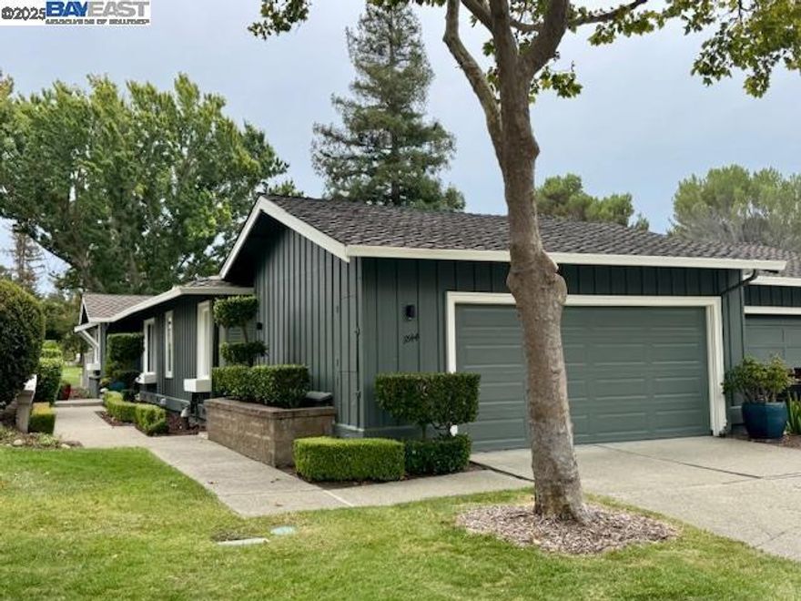 This updated 3 bedroom, 2 bath corner unit townhouse is located in the desirable gated community of Crow Canyon Country Club. With 1,502 square feet of single-level living space and an open view of the 8th hole on the golf course, this home offers both comfort and style in a prime location. Inside, you'll find LVT flooring throughout, along with stone tile in the bathrooms and laundry room. The kitchen was fully remodeled 4 years ago and features Viking Professional stainless steel appliances, including a high-end refrigerator and range, perfect for the home chef.  Other upgrades include recessed lighting throughout, motion sensor outdoor lights for added security and convenience, upgraded front door and closet doors, and 2-car garage with attic access via pull-down ladder ideal for additional storage.  The permitted 3rd bedroom is connected to the primary and perfect for a home office.