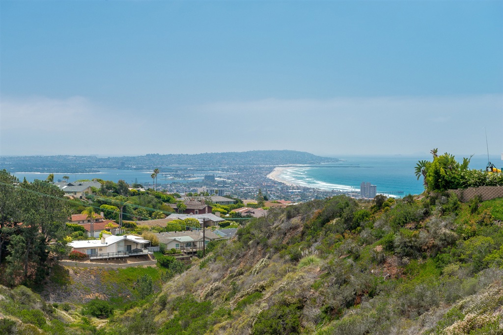 VIEWS! Enjoy incredible ocean, bay, and downtown views from your large backyard equipped with playground, jacuzzi, and outdoor dining table. This well maintained, six bedroom home comes fully furnished. Wood floors throughout most of the home. Large master bedroom with good sized master bathroom attached. Main living all on first level. Ready to move right in! Neighborhoods: La Jolla Mesa View: City,Evening Lights,Valley/Canyon,Panoramic Ocean Sewer: Sewer Connected
