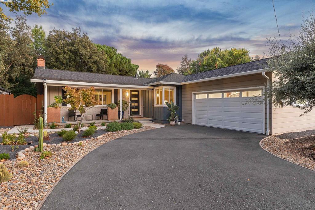 Welcome to modern living at its finest in this beautifully updated three-bedroom home, where style meets everyday comfort. The thoughtfully designed kitchen showcases roll-out cabinets, soft-close drawers, a “hidden” Bosch dishwasher, and a professional Viking gas range—perfect for both daily cooking and entertaining. The living room offers a cozy electric fireplace accented by a handcrafted concrete mantel and custom built-ins, creating a warm and inviting atmosphere.Both bathrooms evoke a spa-like retreat with elegant designer finishes and a soaking tub. Throughout the home, rich hardwood floors, LED lighting, and advanced smart home technology blend convenience with sophistication—including a smart lock that allows you to control entry, along with lighting, temperature, and sprinklers—all from your phone.Step outside to an expansive backyard featuring a generous deck, drought-tolerant landscaping, raised garden beds, and a storage shed. With an attached two-car garage and a prime location in Concord’s sought-after Diablo Estates neighborhood, this move-in-ready home perfectly balances comfort, technology, and timeless design.