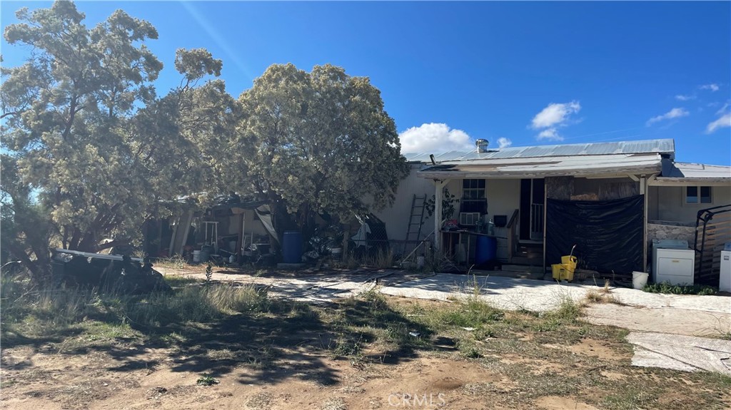 Manufactured Home Built on Mobile home lot with 2 bedroom and 1 bathroom. Approximately 670 sq ft. This manufactured home sits on a flat lot and usable land over 2 acres. Great for farming. There is a private well on this property. Property is fully wood fence. Located on a corner lot. this property to be sold in AS IS present conditions with no repair. This property asking below the market's value, will not last for long. Please call agent for more info.