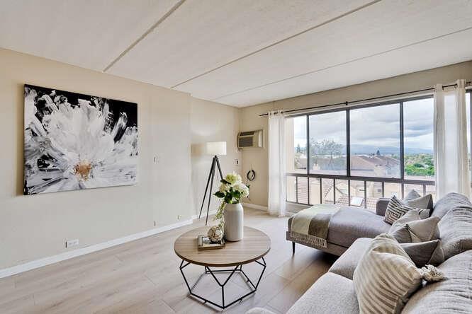 Bright and airy top-floor end-unit condo on the 6th floor with elevator access. Expansive picture windows in the living room and bedroom showcase stunning views of city lights, Silicon Valley, and the mountains. Spacious bedroom with walk-in closet plus pantry/storage closet near kitchen (washer/dryer installation allowed with HOA approval & City permits). Updated kitchen with granite countertops, modern cabinets, dishwasher, and slate tile flooring. Bath with shower over large soaking tub. New LVP flooring in living, dining, and bedroom. Comfort features include wall-mounted AC/heating unit in Living room and electric baseboard heating with thermostat in bedroom. Secure community with controlled access, assigned storage unit, and 1 gated underground parking (#29). Amenities: clubhouse, pool, laundry, sauna, gym & fitness center. Prime location near Santa Clara Town Center, shops, restaurants, transit, high-tech employers, and easy access to Hwy 101, I-280 & expressways. With low Santa Clara utilities and a move-in ready condition. This condo is a wonderful opportunity to own in the heart of Silicon Valley.