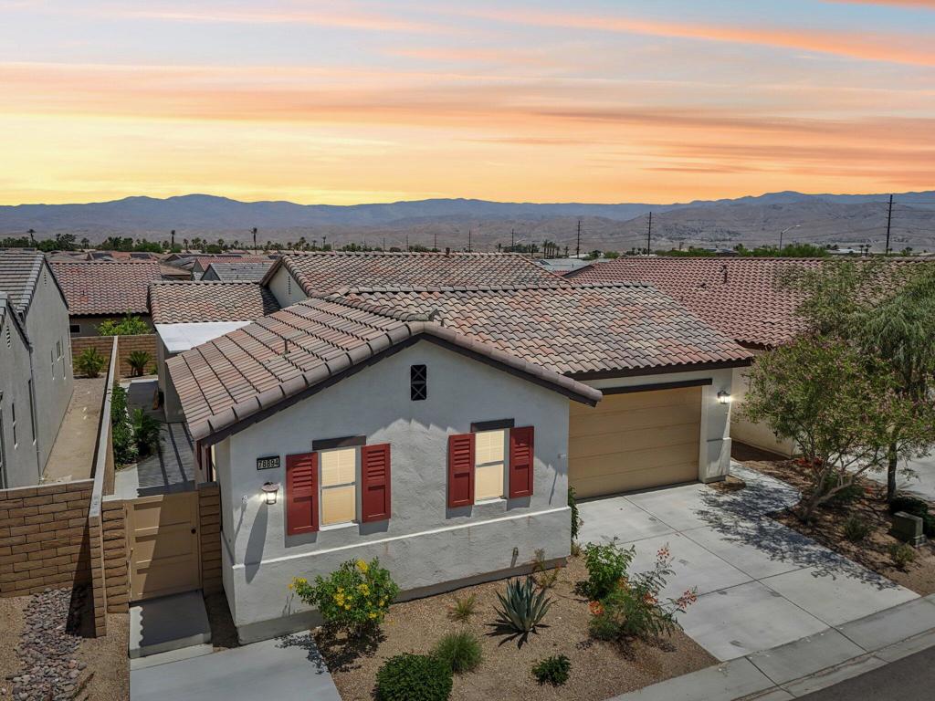 Welcome to Domani, a vibrant 55+ gated community offering resort-style living in the heart of the Coachella Valley. This beautifully furnished, well maintained 3-bedroom, 3.5-bath home features an open-concept layout with soaring ceilings, abundant natural light, and seamless flow between the living, dining, and kitchen areas--perfect for entertaining. The spacious kitchen includes ample cabinetry, modern appliances, and a large island ideal for casual dining. Enjoy indoor-outdoor living in the private courtyard-style patio complete with a pergola ideal for relaxing evenings. Just a short walk from the community's amenities, including a clubhouse, pool, spa, and fitness center. Experience the best of active adult living in this stylish and move-in ready home.