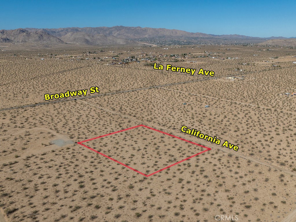 Appr. 680 feet from paved Broadway St ..Fabulous lot not too far from 29 Palms Hwy. Everything you need is just a short drive away. Utilities are nearby. This lot is in San Bernardino County jurisdiction and zoned for JT/RL (Joshua Tree/Rural Living) which allows for single family home and incidental agriculture uses. This is really an unique opportunity to enjoy a peaceful lifestyle with expansive open spaces and breathtaking natural beauty. Do not miss this opportunity to make your dream come true on this blank canvas. Please note that the boundaries represented in the photos are only an estimation. Buyers should verify every aspect aligns with their vision for the property. Address has been assigned by the county.