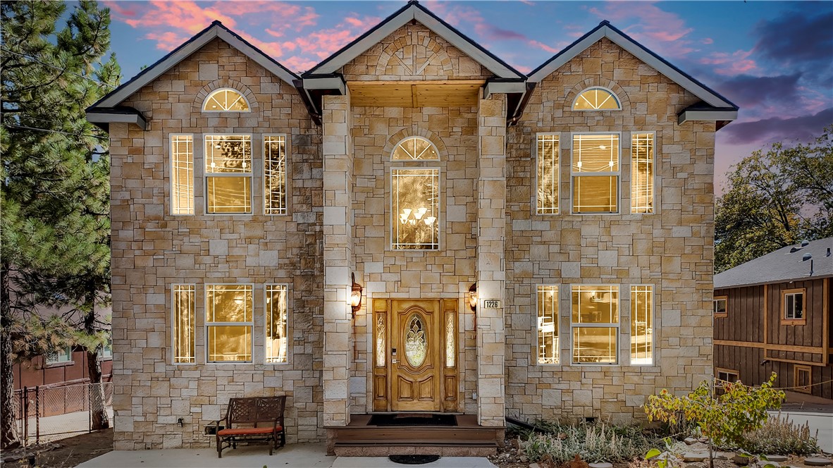 Built in 2006, this stunning mountain retreat blends comfort, entertainment, and convenience into one remarkable home. Whether you’re seeking a full-time residence or a weekend getaway, this property has everything you need for the ultimate Big Bear lifestyle. Offering 4 bedrooms, 2.5 bathrooms, and 2,406 sq ft of living space, this home is thoughtfully designed for both relaxation and entertaining. Upon entry, you’re welcomed into a poker room with a built-in wet bar and a double-sided fireplace that also warms the spacious living room. The large kitchen features ample cabinet space and flows seamlessly into the dining area and living room, where soaring ceilings and abundant natural light create an inviting atmosphere. Upstairs, you’ll find three generously sized bedrooms along with a luxurious primary suite complete with a walk-in closet. The bathrooms are finished with elegant stone accents, adding a touch of mountain sophistication and class. Situated on a nearly 9,000 sq ft lot, the home provides plenty of space to enjoy the outdoors, all while being just minutes from Snow Summit Ski Resort, Big Bear Lake, shopping, dining, and year-round recreation. For added enjoyment, the spacious garage has been converted into a full game room, complete with a pool table, air hockey, arcade games, and a sauna — a true entertainment hub for family and friends. Step outside onto the deck and indulge in your private Jacuzzi, the perfect place to unwind and take in the fresh mountain air under the stars.