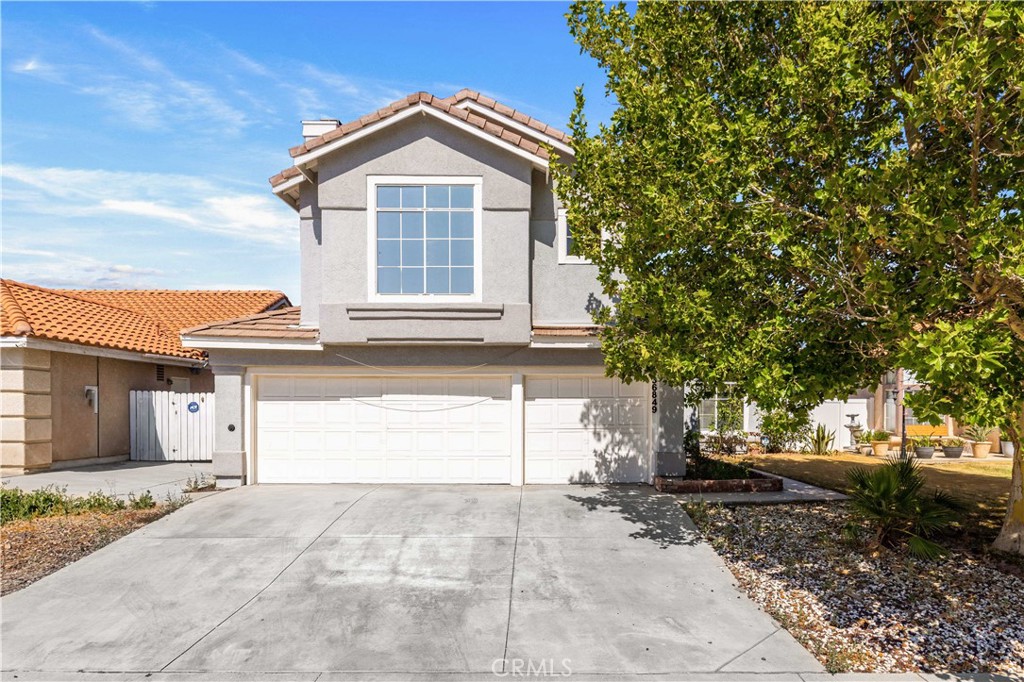 Welcome to this stunning and spacious 4-bedroom, 3-bathroom home that blends comfort, elegance, and functionality. Featuring an open-concept design with soaring high ceilings and abundant natural light, this cozy home offers the perfect space for both relaxing and entertaining. Step into the inviting first floor, where you’ll find a beautifully appointed living room highlighted by a dramatic two-story circular staircase and stylish modern fixtures. The adjacent family room, complete with a warm and cozy fireplace, is ideal for quality time with loved ones. The gourmet kitchen boasts stainless steel appliances, granite countertops, a ceiling fan, and ample cabinetry—perfect for any home chef. A separate laundry room adds convenience, while the fully renovated guest bathroom impresses with LED-lit mirrors and a luxurious rain shower. The 3-car garage is equipped with built-in cabinets and a Tesla charger, making it both practical and forward-thinking. Outside, enjoy a serene backyard retreat with a covered patio, mature pomegranate and apricot trees, and a charming water fountain—an ideal setting for morning coffee or evening gatherings. Upstairs, you’ll find two bright bedrooms with mirrored glass closet doors and a beautifully upgraded full bathroom with rain shower and LED mirrors. The expansive master suite is a true sanctuary, featuring a large walk-in closet, garden tub, and a spa-like bathroom with a walk-in rain shower and elegant finishes throughout. The second floor also offers an additional living room with a cozy fireplace, perfect for intimate dinners or entertaining guests in a comfortable, stylish setting. This beautifully maintained and thoughtfully upgraded home is ready to welcome you in.