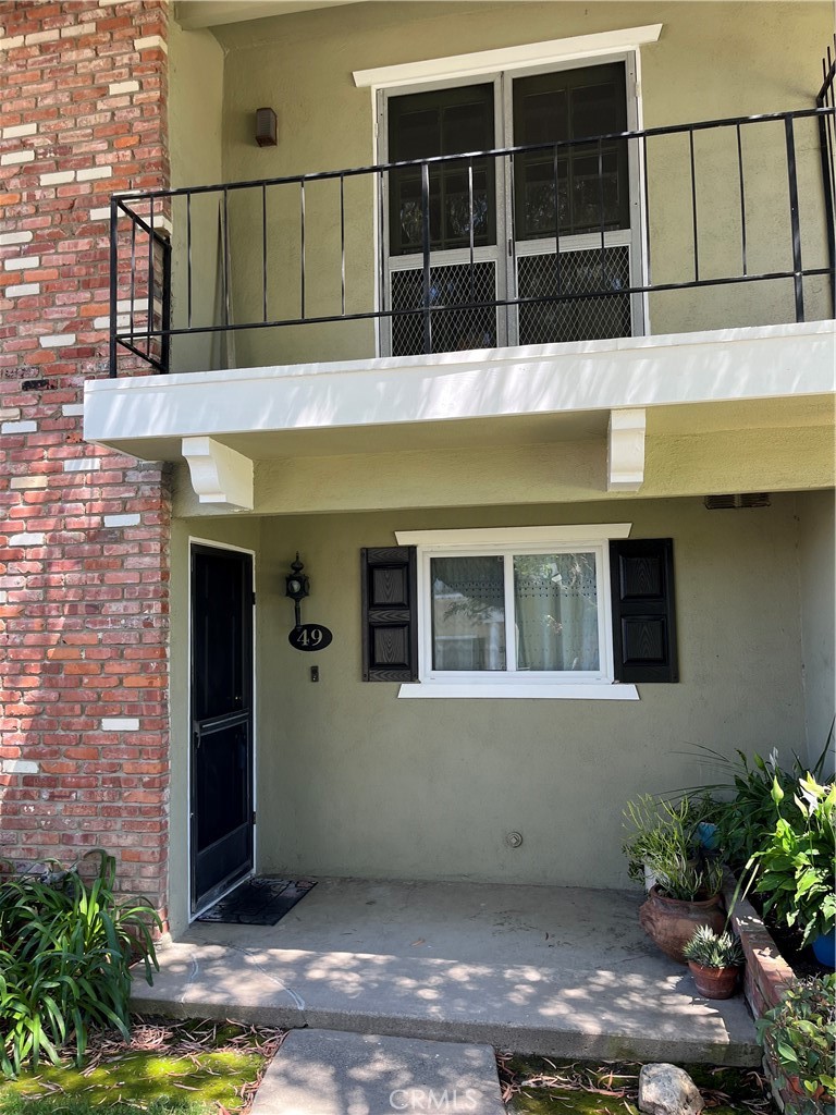 Extra privacy, great end location, attached neighbor on only one side. Large patio connects directly to double car enclosed garage. Upgraded then well cared for home: windows, sliding door, downstairs flooring. Kitchen upgrades include the cabinets, appliances, countertops. Both bathrooms updated. New flooring upstairs, freshly painted throughout. Very clean turnkey home in desirable neighborhood. Los Alamitos School District.