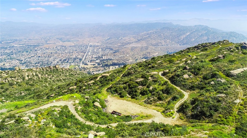 Approximately 26.9 acres of property in Ventura county ready for your imagination and creativity. INCREDIBLE View property with so much potential. Panoramic views can be seen of both San Fernando Valley and Simi Valley. This could be a great development opportunity, a private compound, or whatever idea you can imagine! A paved road already exists up to near the property line, and a dirt road continues to be used for access. It has the potential for an estate, compound, ranch-style, or off-grid property. View homes already located on paved road leading to the property line. Parcels 649-0-020-010, 649-0-020-020, and 649-0-010-040 are all to be sold together. No Exceptions.