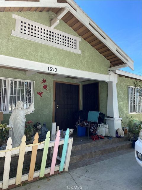 Photo of 1650 W 39th Pl Pl, Los Angeles, CA 90062 (MLS # RS26060562)