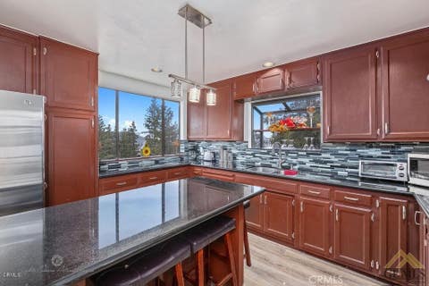 Photo of 1521 Zermatt Dr, Pine Mountain Club, CA 93222 (MLS # SR26073854)