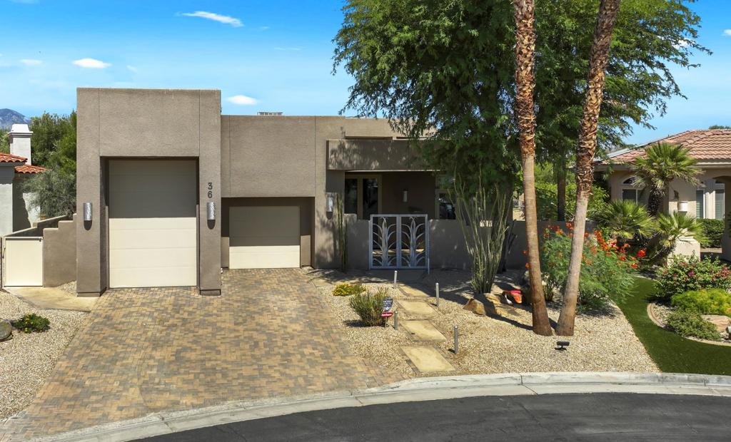 Welcome to desert living at its finest inside the guard-gated community of Montecito in Palm Desert, CA. This contemporary custom-built 4-bedroom, 4.5-bathroom residence offers 3,515 sq ft of living space on a generous 11,761 sq ft lot. Designed for both comfort and elegance, the open-concept floor plan is accentuated by high ceilings, abundant natural light, tile floors in the main living space and custom finishes throughout. The gourmet kitchen is a chef's dream, featuring a Sub-Zero refrigerator, a built-in warming drawer, sleek stone countertops and custom cabinetry. Step outside into a resort-style backyard oasis with a sparkling waterfall pool and spa, lush landscaping and ample space for outdoor entertainment; including a built-in BBQ and space for an icemaker, a built-in Bose sound system, built-in misters, outdoor fans and a custom putting green. With a stairway up to the roof, you have endless views and find the owned 59 solar panels. Enjoy breathtaking desert scenery, sunset views and the ultimate privacy in one of Palm Desert's most sought-after gated communities. With sensational views of the Santa Rosa and San Jacinto mountain ranges, this premier estate backs up to the Desert Willow Golf Resort, a premier golf course, and offers easy access to walking trails just beyond your fence.Additional highlights of this custom home include an indoor firepit with an amazing custom stainless steel hood, 10' high custom solid wood interior doors, a VacuFlo central vacuum system, a bar area equipped with an icemaker and wine fridge, as well as 2 NEW Goodman HVAC units and an RV height garage space. Conveniently located only 2 miles from I-10 off Cook Street, near the JW Marriott Desert Springs Resort and Spa, and less than 1 mile from Ralph's shopping center offering a range of restaurants, coffee shops, a pharmacy, a dry cleaner and a nail salon, this exceptional home is perfect for full-time residents, vacationers, or investors seeking luxury and convenience. Currently, this home is turn-key ready but can be sold unfurnished.