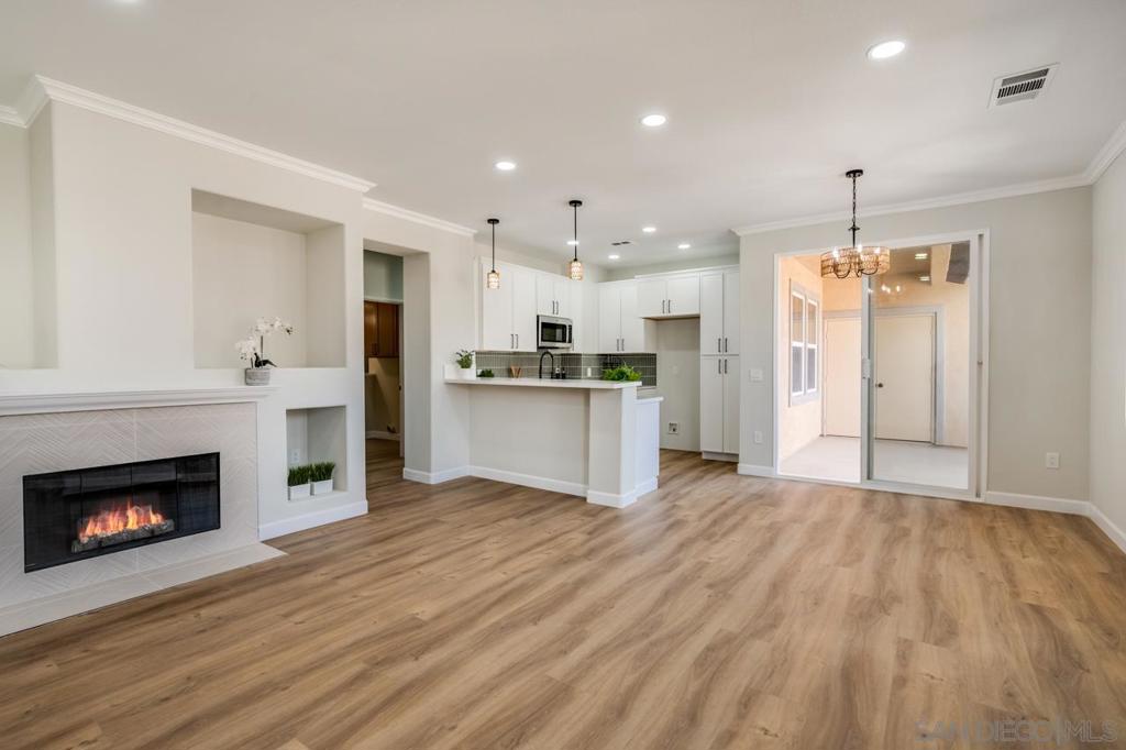 Welcome to your next home! This beautifully remodeled End Unit 3-bedroom, 2-bath condo offers the perfect blend of comfort, convenience, and style. Step inside to a bright and open floor plan featuring a spacious living area, ideal for entertaining or relaxing after a long day. The modern kitchen boasts stainless steel appliances, ample cabinet space, and a breakfast bar that flows seamlessly into the dining area. The primary suite is a true retreat with a massive walk-in closet and a private en-suite bathroom. Two additional bedrooms provide flexibility for family, guests, or a home office. Enjoy the ease of an attached 2-car garage, offering both secure parking and extra storage along with a laundry area with excellent storage. Enjoy the incredible view and venture just steps from your front door to amazing trails and walking paths.