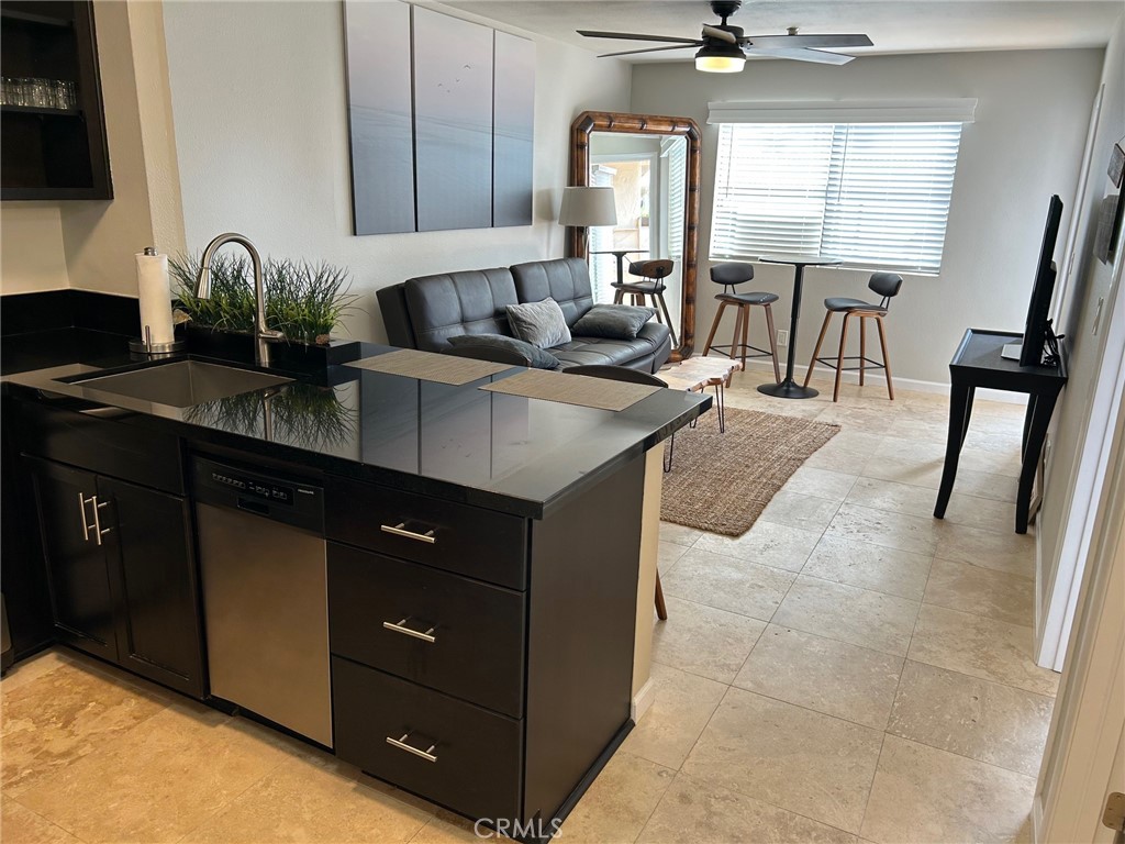 YOUR best life starts here!  AMAZING location!  This unit is located on the Quiet, West Beach-Side of the building on the 1st floor making it ideally situated for easy access!  Relax on your private patio and enjoy cool ocean breezes.  A BEACH Condo that's Elegant and Beach friendly.  This stunning Condo offers 1 bedroom, 1 bath and a lifestyle filled with relaxation.   The living area and bedroom are bright and light.  Chocolate-colored Maple self-closing cabinets with Granite counters in the kitchen and bath. Kitchen has stainless steel appliances and a farmhouse sink. Fun lighting over the breakfast bar.  Bath has a glass vessel sink and tub/shower surround w/beautiful detailed inlay.  Flooring throughout is 18" Travertine in a soft beige color. The Bedroom comes with a large walk-in closet with built-in storage.  Ceiling fans, upgraded interior doors, baseboards, lighting, faucets and fixtures add to the upgrades.  The Friendly Vista Oceana Community offers residents a smoke-free building with locked Lobby Security and GATED parking with your assigned 1-car CARPORT. Guest parking in the front open area, also! Enjoy the common area with outdoor cooking/BBQ.  Take a dip in the Spa/hot tub. Grab your board and bike because you are just minutes away from World-Renowned beaches and some of the best SURF spots in California! Trestles (Upper and Lower), Cottons, San Clemente State Beach, Riviera district, Lost Winds and more. The 2028 Los Angeles OLYMPICS SURFING Competition will be held at Trestles.  You'll be right there!  The closest Beach is only a leisurely 15 minute walk out your door. You also have the San Clemente Beach Trail and Calafia Beach right in your backyard.  You can walk along the beach to the San Clemente PIER. If golf is your thing-walk to the San Clemente Municipal Golf Course just across the bridge just East of the I-5.  HOA dues ($330 month) include WATER, HOT Water, Sewer & Trash-Owners ONLY pay for Electricity and Internet/Cable. With easy access to restaurants, entertainment and the freeway, plus the world's greatest CLIMATE! -- Where else can You get a great condo, price and low HOA to be this close to the SUN, SAND & SURF.....   Looking for that Friendly small condo complex where you can get to know your neighbors--this is it--there are only 48 units in "Vista Oceana".  A RARE find--in the "Vista Oceana" community on the OCEAN side of the 5 freeway in the most desirable SW San Clemente location.