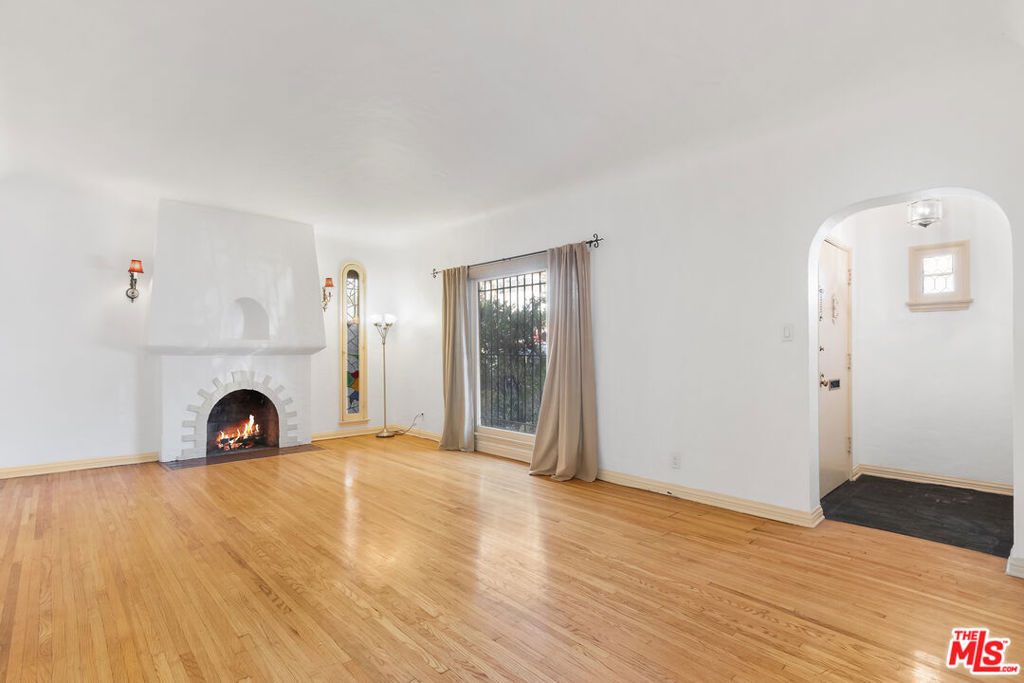 Prime WEHO location! Walking distance to Sunset Plaza, close to Beverly Hills. Very cozy 2-bedroom first floor unit in a Spanish duplex. Facing West, East and North with charming original details. Beautiful living room with decorative fire place, high ceilings, spacious layout with plenty of privacy. Large kitchen with separate breakfast area, study office area. Washer and dryer is in the unit. Large bathroom with separate tub and shower. Hardwood floors throughout. Big closet space. Ceiling fans in every room. One covered carport and plenty of street parking. Landlord pays for water, trash and gardener. Cats are ok, call for dogs. Available to move in from October 15th.