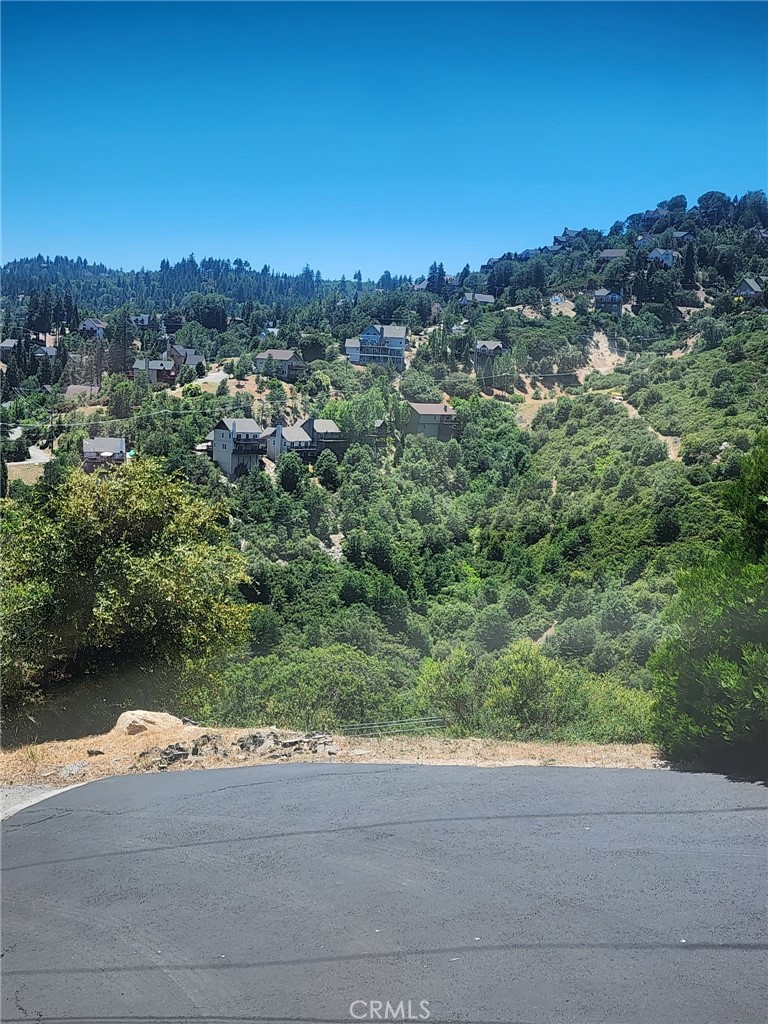 DISCOVER YOUR SLICE OF PARADISE IN LAKE ARROWHEAD!
Build your dream home on this stunning mountain lot, nestled among majestic timber and offering the perfect blend of tranquility and community living. All utilities are available and ready to be connected, making the building process easier.
This property comes with coveted Lake Arrowhead lake rights, giving you access to private lake amenities and the exclusive lifestyle that comes with them. Whether you're planning to build now or invest for the future, owning land with lake rights is a rare and valuable opportunity.
Enjoy the peaceful surroundings of nature while still being part of a vibrant, year-round mountain community. Whether you’re envisioning a cozy weekend cabin or a full-time retreat, this is your chance to claim your place in one of Southern California’s most sought-after lake towns.
Don’t miss out — your mountain escape awaits!
DISCOVER YOUR MOUNTAIN RETREAT IN LAKE ARROWHEAD!
Unlock the perfect opportunity to build your dream home in one of Southern California’s most sought-after lake communities. This beautiful lot is nestled among towering pines and offers gorgeous ridgeline and sunset views—a truly serene setting for your ideal mountain escape.
• Lake rights included! Enjoy exclusive access to Lake Arrowhead and all its amenities.
• All utilities available and ready to be connected.
• Freshly paved road provides easy, year-round access.
• Flanked by vacant lots on both sides for added privacy.
• Owned by the same family for 45 years—a rare and cherished opportunity
Whether you're ready to build your forever home, a weekend getaway, or simply secure lake rights for future enjoyment, this lot is a rare gem. Surrounded by majestic timber and nature’s quiet beauty, yet part of a welcoming and vibrant community.
Don’t miss your chance to claim your piece of paradise in Lake Arrowhead!