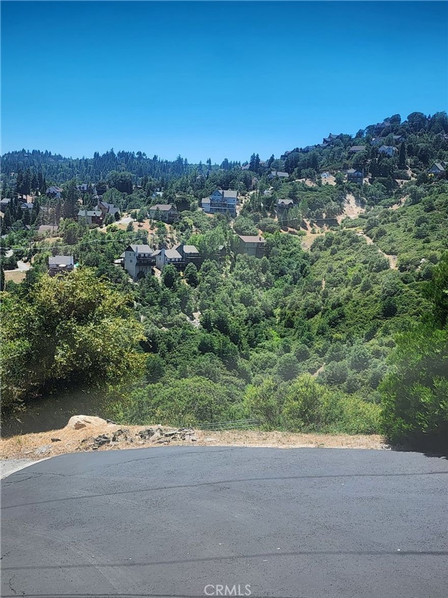 DISCOVER YOUR SLICE OF PARADISE IN LAKE ARROWHEAD!

Build your dream home on this stunning mountain lot, nestled among majestic timber and offering the perfect blend of tranquility and community living. All utilities are available and ready to be connected, making the building process easier.

This property comes with coveted Lake Arrowhead lake rights, giving you access to private lake amenities and the exclusive lifestyle that comes with them. Whether you're planning to build now or invest for the future, owning land with lake rights is a rare and valuable opportunity.

Enjoy the peaceful surroundings of nature while still being part of a vibrant, year-round mountain community. Whether you’re envisioning a cozy weekend cabin or a full-time retreat, this is your chance to claim your place in one of Southern California’s most sought-after lake towns.

Don’t miss out — your mountain escape awaits!



DISCOVER YOUR MOUNTAIN RETREAT IN LAKE ARROWHEAD!

Unlock the perfect opportunity to build your dream home in one of Southern California’s most sought-after lake communities. This beautiful lot is nestled among towering pines and offers gorgeous ridgeline and sunset views—a truly serene setting for your ideal mountain escape.

• Lake rights included! Enjoy exclusive access to Lake Arrowhead and all its amenities.

• All utilities available and ready to be connected.

• Freshly paved road provides easy, year-round access.

• Flanked by vacant lots on both sides for added privacy.

• Owned by the same family for 45 years—a rare and cherished opportunity



Whether you're ready to build your forever home, a weekend getaway, or simply secure lake rights for future enjoyment, this lot is a rare gem. Surrounded by majestic timber and nature’s quiet beauty, yet part of a welcoming and vibrant community.

Don’t miss your chance to claim your piece of paradise in Lake Arrowhead!