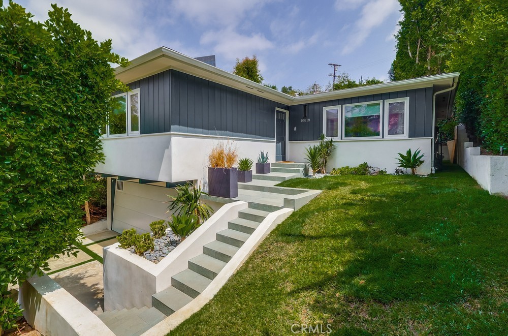 **Don’t miss this incredible opportunity to own a truly special home in one of Studio City’s most desirable locations!**
Nestled *south of the boulevard*, just minutes from Universal Studios, Hollywood, and the beloved Studio City Farmers' Market, this charming mid-century modern home blends timeless style with comfort and privacy. You'll also love the unbeatable proximity to local favorites like **Sprouts, Equinox, Erewhon**, and an array of dining and shopping options that make everyday living feel elevated.
A mature ficus hedge surrounds the front of the property, creating a peaceful sense of seclusion, while the gated driveway and detached garage add convenience and charm. Step inside to a light-filled, open-concept living space that offers a warm, minimalist feel and seamless indoor-outdoor flow—perfect for both relaxing and entertaining.
Originally renovated in 2011, the home includes important system upgrades such as copper plumbing, an upgraded electrical panel, a new HVAC system, and a new water heater. More recent updates include fresh interior and exterior paint, new stucco, and beautifully refreshed landscaping. Additional features that add to the home’s appeal are a new washer and dryer, a sleek stainless steel stovetop, an automatic security gate, drip irrigation, new light fixtures, Google security cameras, and French drains with flood prevention around the property.
With its prime location, thoughtful upgrades, and undeniable charm, this home is not only a smart investment—it’s a rare gem you won’t want to miss!