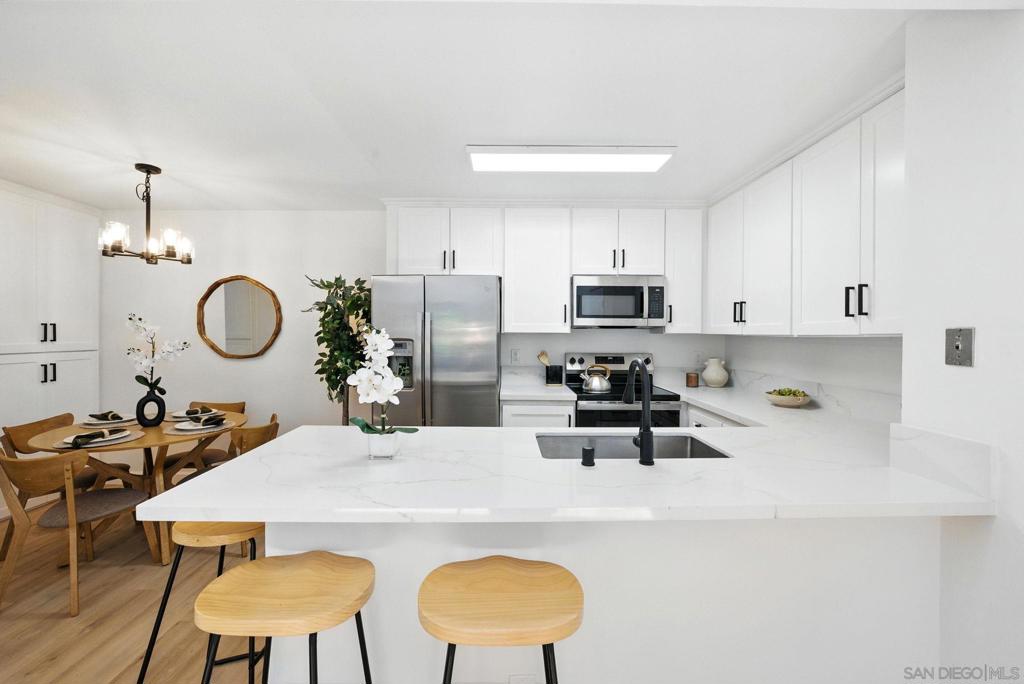 Discover your fully remodeled top-floor condo in the Summer Hill community of Serra Mesa. This light and bright unit features a beautifully updated kitchen and bathroom, brand new luxury vinyl plank floors, modern fixtures, and stylish finishes throughout. The open living area includes vaulted ceilings with plenty of natural light. This unit is in a prime location within the complex, with views from your balcony overlooking the pool, spa, and green area. Summer Hill amenities include a sparkling pool, spa, BBQ area, and a game room for entertaining guests. Located just minutes from downtown, local beaches, restaurants, and major freeways.