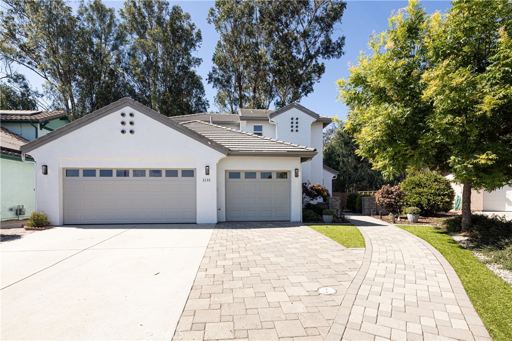 This beautiful 2,590 sq. ft. turnkey home located in the highly desirable Stone Creek Development near French Park exudes charm and sophistication. Two Mockorange trees in the side yard provide sweet scents and flowering beauty. Located at the end of a quiet cul-de-sac, this home boasts an open and bright floor plan. Upon entering the front entrance you are greeted with tile floors and a wonderful paint scheme throughout that is in pristine condition. The main level features the primary bedroom and adjacent ensuite bathroom with jetted soaking tub and two expansive walk-in closet. Sliding doors from the primary bedroom lead to a private patio next to a Koi pond with waterfall, permanent awning and filtration system. A formal dining room adjacent to the kitchen can also be accessed from the main hallway. The kitchen and adjoining family room with fireplace provide a cozy family space and can be accessed through a rear door. The kitchen includes a large island with bar seating, a five burner gas stove, a Samsung refrigerator and a Bosch dishwasher. Four matching barstools are included in the sale of this home. A separate office or bedroom is also located on the main level immediately across from the laundry room and can be entered through the garage or the front door. The second floor, up a beautiful wooden banistered stairway, features three additional bedrooms and one full bathroom. A three car garage offers plenty of space for your vehicles and lots of storage. This home has forced-air heating, both electric and gas hook ups for a dryer in the laundry room, and a tankless water heater that is less than one year old. A freshly painted exterior makes this home stand out. The rear of this house backs up to open space with a creek offering a very private setting. This house offers two great entertaining spaces for you to enjoy while also providing seclusion and privacy, the Koi pond patio area and the side yard with Orangequat, Meyer Lemon and lime trees all growing along the back fence line. Located in the highly ranked San Luis Coastal Unified School district, this elegant home provides easy access to shopping, parks, hiking trails and all the Central Coast has to offer. Information deemed reliable, not guaranteed.