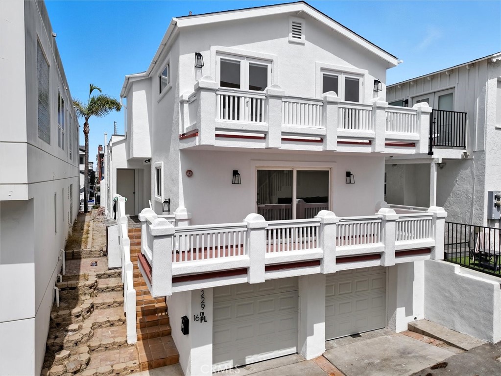 Stunning Ocean Views Just 2 Blocks from the Beach! Live the coastal dream in this beautifully remodeled 2 bedroom, 1.5 bath apartment—just steps from the sand and a short stroll to award-winning restaurants, cozy cafés, and a wide array of boutiques near the Manhattan Beach Pier. Enjoy breathtaking ocean views from the large private balcony off the light-filled main living area, which features new hardwood floors and powder bath. The freshly updated kitchen includes stainless steel appliances, a breakfast bar, and plenty of counter space and storage. Upstairs, you’ll find a newly remodeled bathroom and two bedrooms, each with French doors that open to a second balcony offering sweeping views of the Pacific. The private 2 car garage features tandem parking, laundry area as well as ample storage space for bikes, beach chairs, and surfboards. Whether you're looking for a weekend retreat or a year-round beachside residence, this home offers the best of Manhattan Beach living.