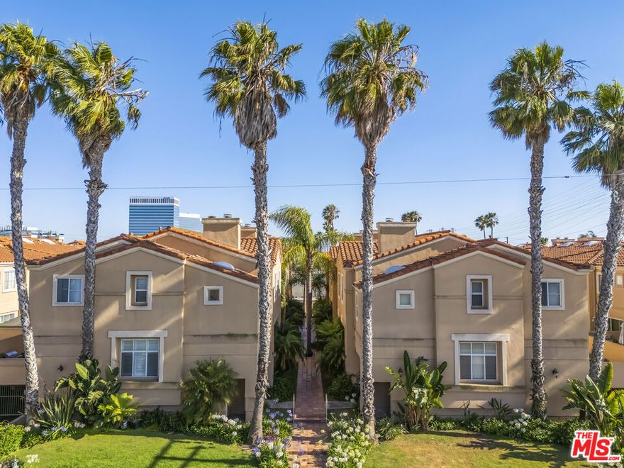 Welcome to this stunning Contemporary Mediterranean style home in the highly desirable city of El Segundo! This bright and freshly painted end-unit townhouse features 3 bedrooms and 2.5 bathrooms, offering the perfect blend of comfort, convenience, and modern style. As you walk down the beautifully manicured path to the front door, you'll be greeted by lush greenery that sets a serene tone. Step inside to find a spacious family room or office, complete with high ceilings, abundant windows, and a cozy fireplace a perfect space to unwind or work from home. Just a few steps up, the open-concept living, dining, and kitchen area awaits. The kitchen includes a charming breakfast nook and a convenient half bath. The living area boasts sliding glass doors that open to a large private patio ideal for morning coffee, entertaining guests, or simply relaxing outdoors. The third floor, newly carpeted for comfort, features three bedrooms, a full hallway bathroom, and a convenient laundry area. The primary suite includes its own fireplace, and an ensuite bathroom with dual sinks and a granite countertop, plus additional built-in closets. Additional highlights include nest thermostat, custom blinds throughout the home, two side-by-side parking spaces in a secure gated garage, and close proximity to top-rated schools, parks, shops, dining, and the beach. Enjoy easy access to major freeways and LAX, making commuting a breeze.Move-in ready and full of charm, this home combines contemporary living with an unbeatable El Segundo location. Don't miss the opportunity to make it yours!
