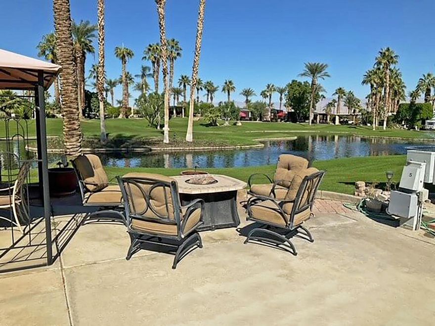 This prime building lot offers breathtaking views in both directions, with a west-facing orientation overlooking a tranquil pond, water fountain, and spectacular sunsets, while the front of the coach faces east. Perfectly situated near all resort activities, it boasts a central location with a golf course view free from errant golf balls and a direct line of sight to the bocce ball courts. Ready to build, the lot has been surveyed and comes with pre-approval for a casita, with all necessary documentation available. The outdoor kitchen is equipped with tiled counters, a BBQ, cooktop, sink, refrigerator, dishwasher, and ample storage, making it ideal for entertaining. Offered unfurnished, this is truly one of the most desirable lots in the resortOutdoor Resort Indio is a Class A only RV resort.