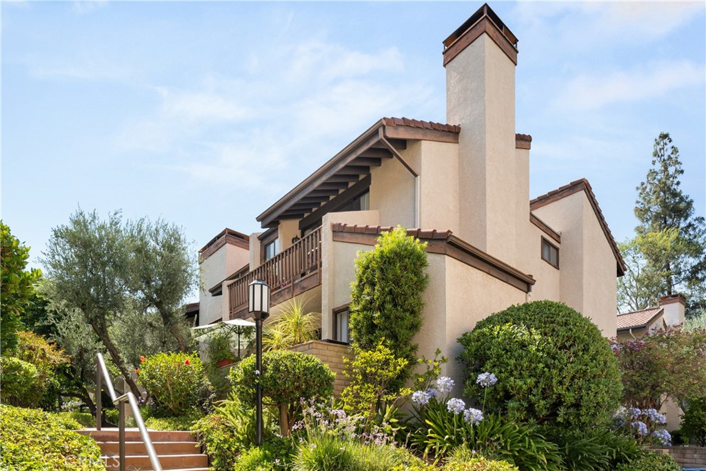 Spacious light and bright corner end-unit townhouse featuring 3 bedrooms + bonus room, 3 bathrooms, 3 stories, and a private 2 car garage. Great location in the complex right next to the hot tub and a resort-worthy pool. Open concept layout perfect for entertaining. Just upstairs, the primary bedroom serves as a tranquil retreat with a cathedral ceiling, generous closet space, and direct access to a private balcony. 2 more generously sized bedrooms and 1 large bonus room complete this spacious townhome. Additional features include several outdoor areas which include a massive open patio area, 2 private bedroom balconies, and a greenroom. Quiet and secluded townhome community offers resort-level amenities, including three swimming pools with spas, a tennis court, racquetball court, and sauna. Warner Center park is adjacent for play, walking and summer evening concerts. Minutes from Topanga Mall, The Village, shopping and dining on Ventura Blvd, and easy access to the freeway.