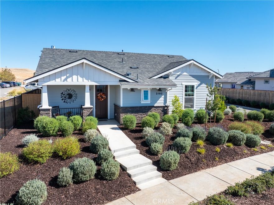 Your dream home awaits, in Vintage at River Oaks! This beautifully upgraded, professionally decorated residence is truly move-in ready. One of only a couple of 'Geneseo' models in Vintage @ River Oaks, this home strikes a perfect balance of size, value and convenience, with just over 1,700 SqFt of thoughtfully designed living area.  The owner has made a significant investment into upgrading this home.... both inside and out. Gorgeous, low maintenance landscaping covers every inch of the site, providing inviting spaces for entertaining friends and family. Two custom patio awnings provide shaded places to relax and enjoy the wine country lifestyle so many only dream of. Views to the east look out to acres of rolling vineyards, while views to the west from the covered front porch will allow you to take in the sunset views.  Inside, you'll feel like you're in the model home, thanks to the tasteful appointments in every room.  The den is a welcome retreat and would make a great home office (or could easily be converted back to the original 3rd bedroom - see floorplan). Custom window coverings, flooring and wall coverings make the interior feel like a million dollars! You'll love the large walk-in pantry in the island kitchen, and the equally impressive walk-in closet in the primary bedroom.  And be sure to notice the zero-threshold walk-in shower, with upgraded tile all the way to the 9' ceiling. There really are lovely upgrades and extras everywhere you look! You'll also appreciate the OWNED solar (providing zero use electric bills), and the extra deep driveway - the envy of everyone in the neighborhood! This special home has one more feature that you won't find at even one other home in this 142 lot development - an oversized, 'island' lot! At just over 7,500SF, the lot is already one of the largest in Vintage. But it is the fact that this lot has no adjoining lot lines with neighboring homes that makes it truly unique.  And you can tell all your friends you 'live on an island' (LOL)!  This home has been priced to sell quickly! Don't miss your opportunity as you may never find another one quite like this!