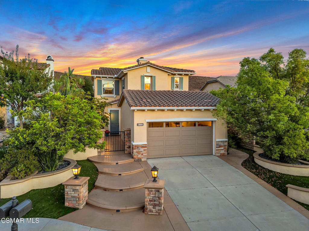 Embraced by the rolling hills of Big Sky, this Cross Pointe two-story beauty offers 4 bedrooms, 3 bathrooms, and 2,034 sq. ft. of light-filled living space on a prime 5,490 sq. ft. lot--an ideal backdrop for everyday living and lasting memories. From its stacked stone accents and lighted pillars to freshly stained stamped-concrete walkways, every detail reflects pride of ownership. Drought-tolerant landscaping with artificial turf, shade trees, and landscaped planters create curb appeal with ease of care. Inside, the living and dining areas flow together with wood flooring, crown molding, wide baseboards, and three-inch shutters on dual-pane windows. A gas fireplace with a media niche, surround sound, and recessed lighting set the tone for warm gatherings. The open kitchen is designed for everyday living and entertaining, featuring granite counters, a center island with seating, stainless GE and Whirlpool appliances, a walk-in pantry, under-cabinet lighting, and a window framing backyard and open-space views. Step outside to a private retreat backing to open space with a magical view of the Simi hills, a large stamped-concrete patio, circular fire-pit seating, tropical landscaping, storage shed, and low-maintenance turf. Whether hosting friends or enjoying quiet evenings under the stars, the backyard is a true extension of the living space. The home includes a downstairs bedroom and bath, perfect for guests, while upstairs offers a loft/homework station, laundry room, two secondary bedrooms, and a hall bath. The spacious primary suite features abundant windows, a walk-in closet, and a bath with dual granite vanities, a soaking tub, and glass-enclosed shower. Other fine features include: an EV charging station and floor-to-ceiling built-in storage cabinets covering one entire wall in the garage, a Rain Bird irrigation timer system, a newer HVAC system, dual-pane windows with shutters, updated crown molding and baseboards throughout, under-cabinet lighting, and soft-closing cabinet doors and drawers in the kitchen. Outdoors, enjoy built-in speakers, solar landscape lighting, and freshly stained stamped-concrete patios and walkways that add both function and curb appeal. Living in Big Sky means more than a beautiful home--it's a lifestyle. Enjoy nearby Big Sky Park, hiking and biking trails, dog parks, and easy access to shopping, dining, golf and more. Here, the warmth of home meets the beauty of the outdoors in a way that feels truly unforgettable.