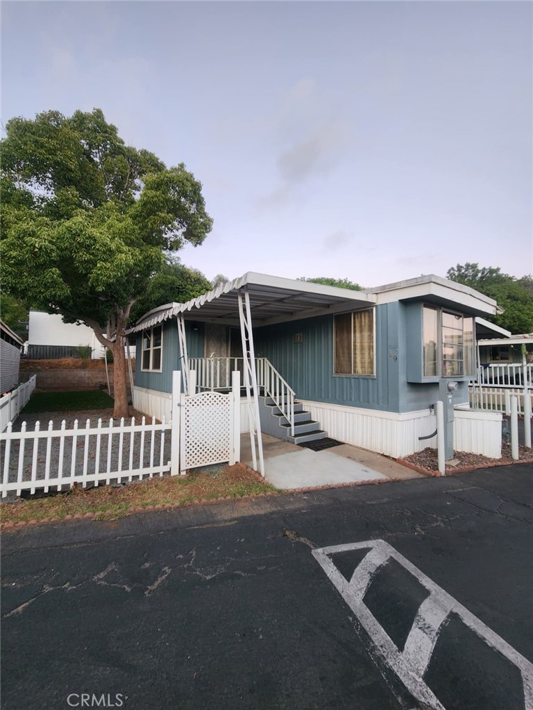 Lovely home right in the heart of El Cajon in the Starlight Mobile Home Park close to the freeway, schools, shopping and much more. This home is move in ready with new flooring, updated bathroom and kitchen, covered parking, a shed and private yard space on the side with a porch and a big mature tree that could provide shade for you and your family. Community features a beautiful pool, clubhouse, laundry facilities and plenty of guest parking. This is an all ages park, must get park approval.