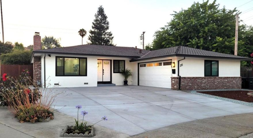 Welcome to your Morgan Hill retreat! Nestled in a quiet northwest neighborhood just minutes from the vibrant downtown and only 25 minutes to San Jose, this charming 3-bedroom, 2-bath home offers 1,462 sq. ft. of turn-key living space. Recently remodeled for comfort and functionality, the open layout flows seamlessly from the living room, kitchen, nook, and dining area to a spacious backyard, perfect for entertaining. The modern kitchen features premium stainless steel appliances, sleek cabinetry, and quartzite countertops with full backsplash. Bathrooms are updated with marble double-sink vanities, LED mirrors, and porcelain tile floors. A cozy fireplace plus a brand-new central AC and heating system ensures year-round comfort. Energy-efficient upgrades include double-pane windows, tankless water heater, low-maintenance landscaping, and ceiling fans. The oversized garage with laundry area and utility sink adds convenience, while the outdoor oasis boasts a 100-foot organic planter box, smart irrigation with rain sensor, RV/boat parking, and space for a future ADU. This home blends modern upgrades, energy efficiency, and outdoor living ready for its next owner. Don't wait, it won't last long!