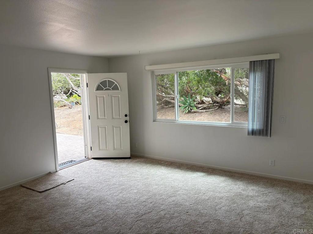 Charming two bedroom two bath, approx. 940 sq. ft., west of I-5, near beach, with a large off-street parking lot. Freshly painted inside. Newer windows, newer Bosch dishwasher, new carpeting, bathroom upgrades, with a nice size yard. Walking distance to neighborhood community park. The tenant is responsible for Gas and Electric. The water bill is split monthly with the tenants and landlord. The landlord pays for the gardener. Coin-operated washer/dryer onsite to be shared with other unit. No smoking. No pets. Showings: Easy to show, just call the owner for appointment to qualified rental candidates. West of I-5 just a short walk to community park and beach. A one-year lease is required. Landlord is a real estate broker representing self.