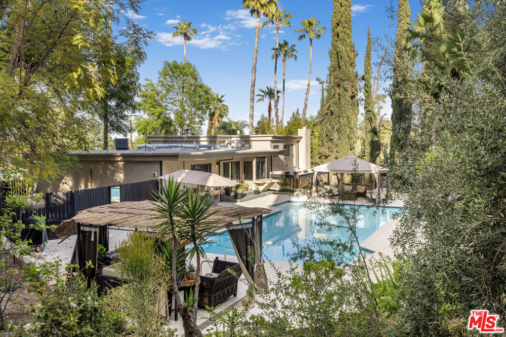 This property is available for short-term and long-term rentals, each with respective pricing options. It is fully furnished, decorated, and equipped with hotel-like essentials and amenities. With our concierge team available to assist 24/7, this home rental offers a five-star hospitality experience.Whether you're staying for a few days, a month, or an entire year, this stunning Tulum-style estate offers a five-star hospitality experience in the heart of the San Fernando Valley. Tucked away on a quiet cul-de-sac in the serene Woodland Hills neighborhood, this fully remodeled 4-bedroom, 4-bathroom sanctuary is the epitome of private, resort-style living.Every inch of the home has been thoughtfully renovated with brand-new, high-end finishes and modern touches, creating a fresh, inviting atmosphere throughout. The spacious chef's kitchen is equipped with top-of-the-line appliances and ample counter spaceideal for entertaining or enjoying a peaceful evening in.Designed with a seamless indoor-outdoor flow and grounded in warm, organic textures, the home captures the essence of California-meets-Tulum luxury. Step outside into your own private oasis, complete with a large pool, chic cabana lounge, and captivating fire features that set the scene for unforgettable sunset soires.For the active traveler, the property includes a fully equipped yard and a basketball court. Outdoor living is elevated with alfresco dining areas, a premium BBQ setup, and lush tropical landscaping.Though it's tucked away for maximum privacy, you're just minutes from the best that Ventura Boulevard has to offertop-rated dining, shopping, and local attractions.