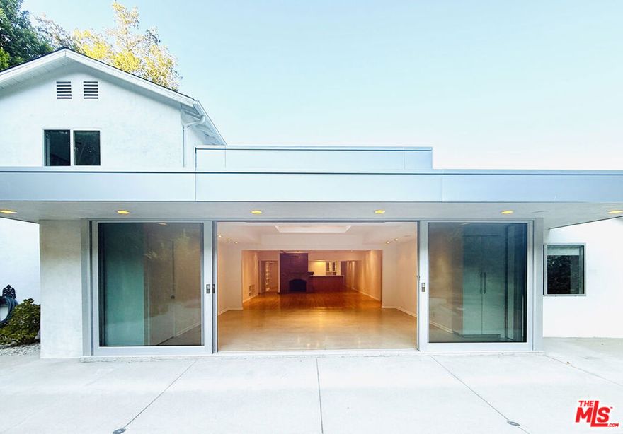 Terrific location south of Ventura Blvd. Spacious 5 bedroom and family room with 3112 sq.ft. Living and Family rooms with fireplaces, built-in book cases and custom lighting. Hardwood floors throughout. Formal dining room and very spacious kitchen with marble center island and breakfast area. Kitchen has top appliances including Subzero refrigerator, Wolf range and Miele dishwasher. Separate laundry area with Miele washer & dryer. Skylights and high ceilings. Master bedroom has private bath with dual vanities and glass shower with skylight. Glass doors open to private rear yard with salt water Pool & Spa (healthier than chlorine)! Beautiful indoor-outdoor flow from house to the garden. Very conveniently located to new high end Ralph's, Whole Foods & Erewhon Markets for shopping. Very close to Harvard-Westlake and walking distance to Buckley School.