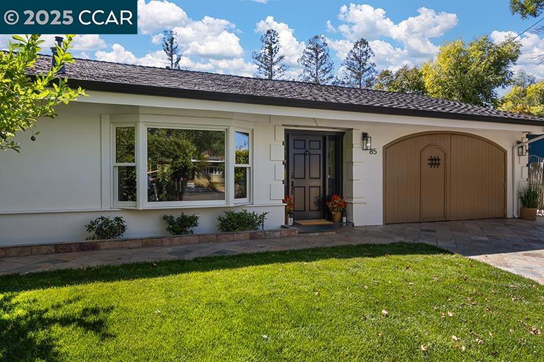 Perched above Tice Valley in Walnut Creek’s desirable Parkmead neighborhood, this beautifully remodeled and expanded single-level home blends classic ranch style with Mediterranean elegance. The result is a warm, inviting retreat with exceptional craftsmanship and breathtaking views of the East Bay hills. Step into the custom chef’s kitchen, anchored by a premium stainless steel Wolf range, exotic Bubinga wood cabinetry, hammered copper sinks (in both the kitchen and wet bar), travertine flooring, and rich granite countertops — all reflecting high-end quality. The spacious primary suite is a true sanctuary, featuring walls of glass and a spa-inspired bathroom with a steam shower for ultimate relaxation. Additional highlights include: Custom interior doors and hardware. Dual-pane windows and doors for comfort and energy efficiency Bonus room (approx. 300 sq. ft) ideal for a dining room, home office, or flexible living space Outside, the flat backyard is a blank canvas ready to be transformed into your dream outdoor oasis — perfect for gardens, al fresco dining, or entertaining under the California sky. A rare opportunity to enjoy elevated living with privacy, style, and jaw dropping views — all just minutes from downtown Walnut Creek, top schools, and hiking trails.